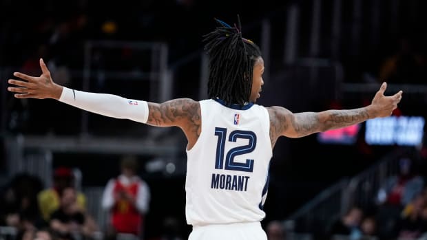 Memphis Grizzlies guard Ja Morant reacts after his team makes a shot.